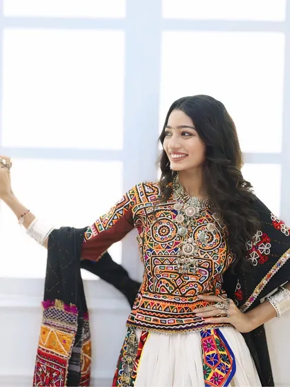 A close-up of the Navratri look, showing the intricate embroidery of the blouse and the complementary soft makeup.