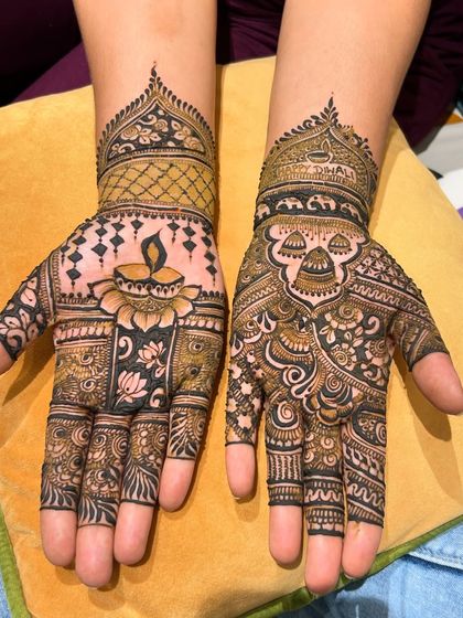 A closer look at the Diwali-themed henna, showcasing the details of the diya, lotus flowers, and the elephant motif.