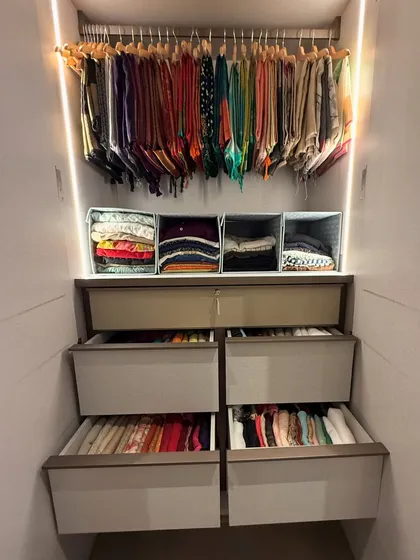 This image shows how we combine hanging storage for delicate items with deep, organized drawers for folded clothes, creating a complete wardrobe system.