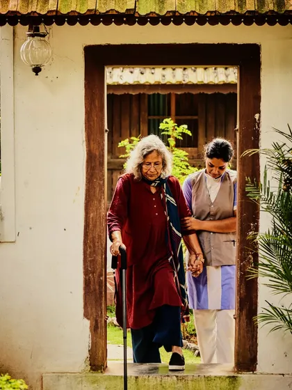 We provide compassionate, specialized care for all ages. Here, one of our dedicated therapists assists a senior guest on her healing journey, showcasing our commitment to providing a safe, respectful, and nurturing environment for everyone.