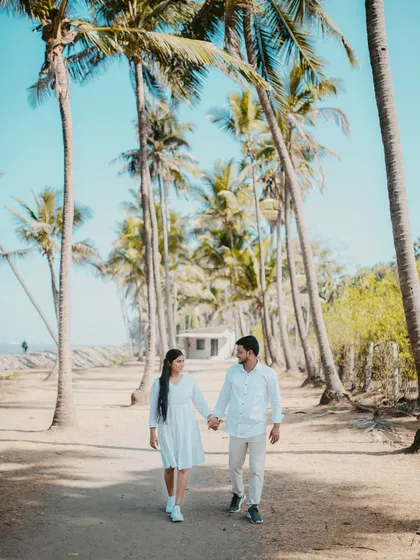 A beautiful pre-wedding walk through a lane of palm trees. I use leading lines and natural frames to create beautifully composed couple portraits.