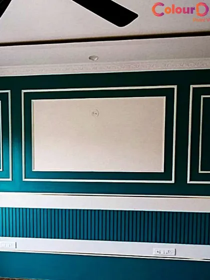We created a timeless and elegant look in this room by combining a rich, deep teal paint with classic white wall beading. This technique adds architectural detail and a touch of sophistication, elevating the entire space.