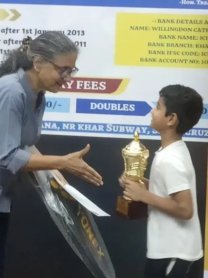 Ajinkya receiving his gold trophy at the Wellingdon Catholic Gymkhana tournament for his win in the under-11 boys singles.