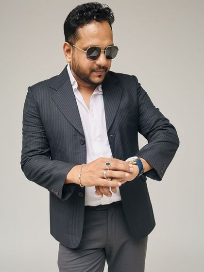 This dark pinstripe blazer is a classic choice for a mature and sophisticated look. It's perfect for formal dinners or important family gatherings.