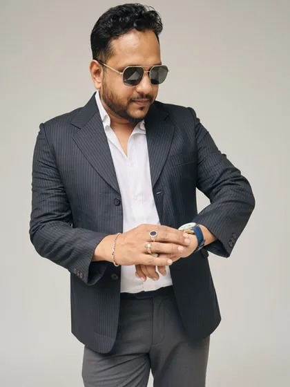 This dark pinstripe blazer is a classic choice for a mature and sophisticated look. It's perfect for formal dinners or important family gatherings.