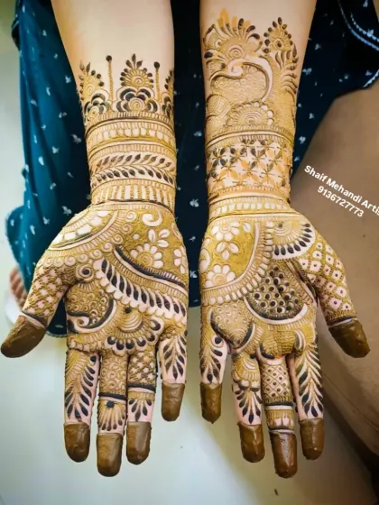 A full-palm design featuring a peacock on one hand and a floral cuff on the other, with covered fingertips for a dark stain.