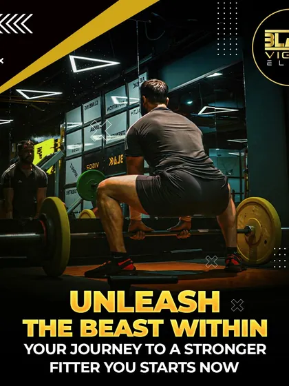 Unleash the beast within. A member prepares for a heavy squat, one of the most effective compound movements for building overall strength. Your journey to a stronger you starts now.