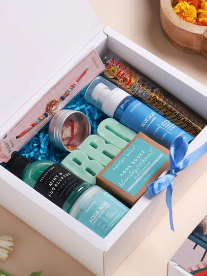 This is the blue-themed 'BRO' hamper, up close. It includes a Blue Clay facial cleanser, Mint & Eucalyptus shower gel, and an Aqua Boost soap bar for a refreshing experience.