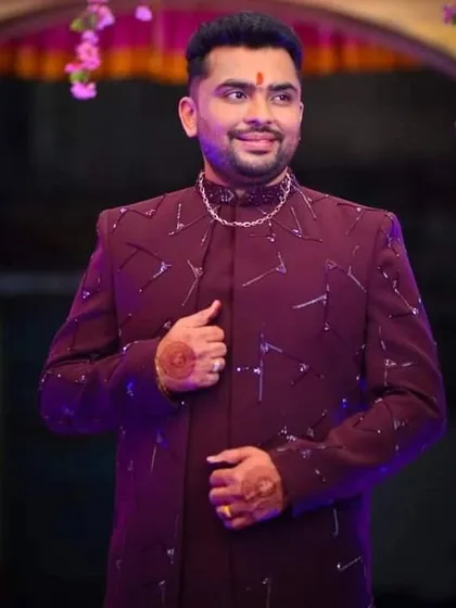 This wine-colored Indo-Western piece is a popular choice for Sangeet nights. The jacket is embellished with precise katdana work, giving it a subtle yet striking appearance that stands out.