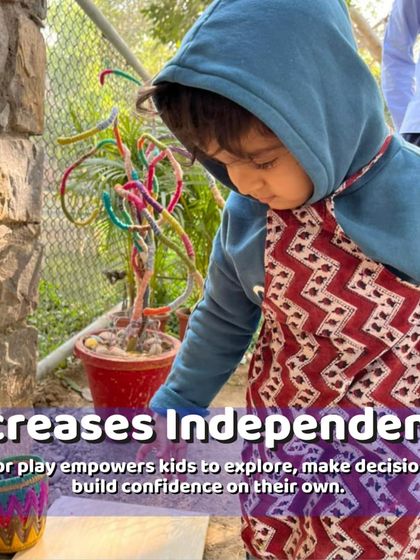 Exploring the garden empowers kids to make their own discoveries and build confidence. This little one is intently studying a plant, lost in his own world of wonder.