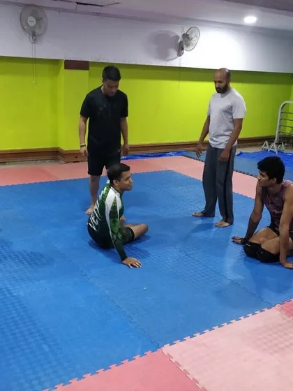 Another angle of Coach Sharmaji's visit, showing our students intently watching his demonstration. Learning from different perspectives is invaluable.