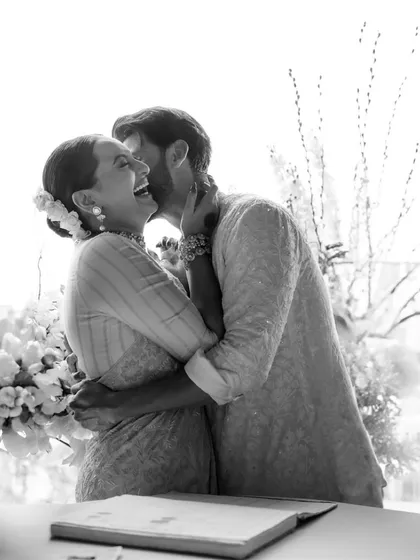 A moment of pure joy and love as Sona and Zaheer embrace after their wedding ceremony. Shot in black and white, the focus is entirely on their radiant smiles and heartfelt connection.