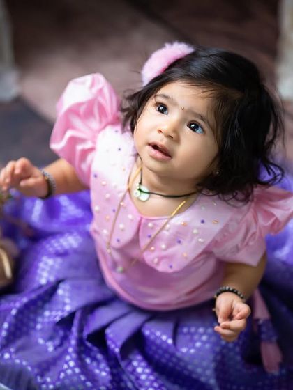 Looking up in wonder. This is a beautiful candid shot from a traditional-themed photoshoot.