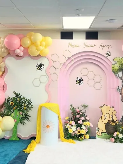 Another wide view of the sweet and gentle Winnie the Pooh setup, perfect for celebrating a new arrival.