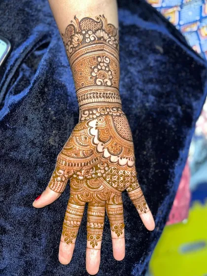 Look at the incredible progress. This intricate hand design, complete with a peacock motif, was created by a student after taking my course, showcasing their newfound skill in detailed work.