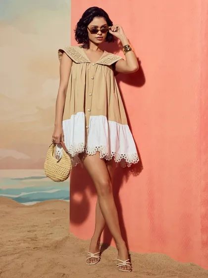 A full-length view of the Sand Sailor Dress by Qala Clothing, showcasing the complete silhouette and styling.