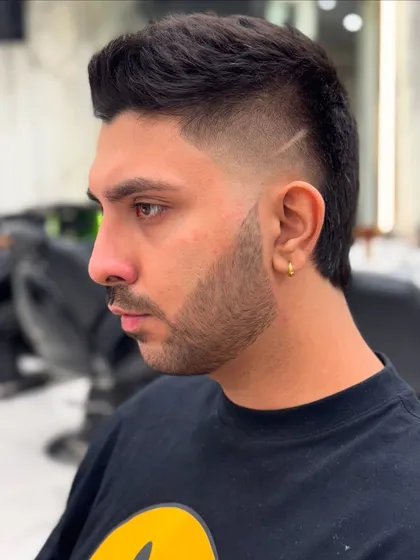 Check out this fresh fade with clean lines. I created a modern mullet style, adding a sharp line detail for that extra edge. This is the kind of cut that gets you noticed.