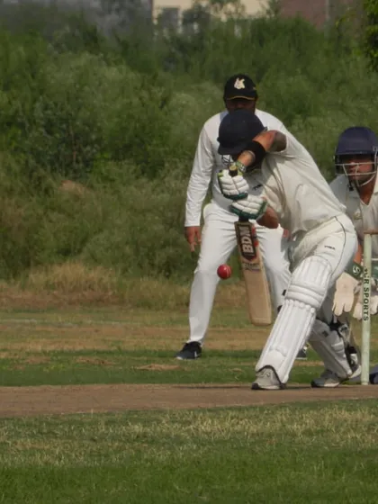 A batsman fully focused, playing a classic shot during a competitive match. Our tournaments are designed to give you the feel of real, high-quality cricket, moving beyond net practice.
