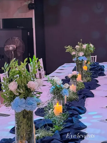 A wide view of the blue and white themed dining arrangement, showing how all the elements come together. This setup is versatile enough for a birthday dinner, a formal party, or a corporate event.