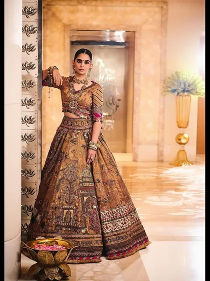 Styling Isha Ambani Piramal in a spectacular heritage lehenga from Delhi Vintage Co. The rich, earthy tones and intricate panel storytelling make this a piece of wearable art.
