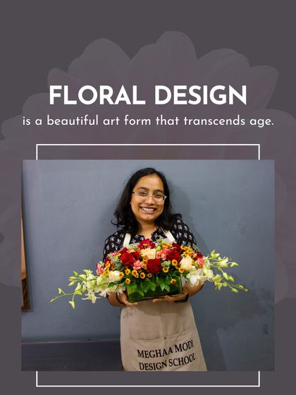 A student holds her beautiful, horizontally-designed arrangement. This showcases the variety of styles and techniques my students learn.