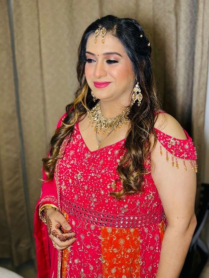 A side profile, showing the soft curls in her hair.