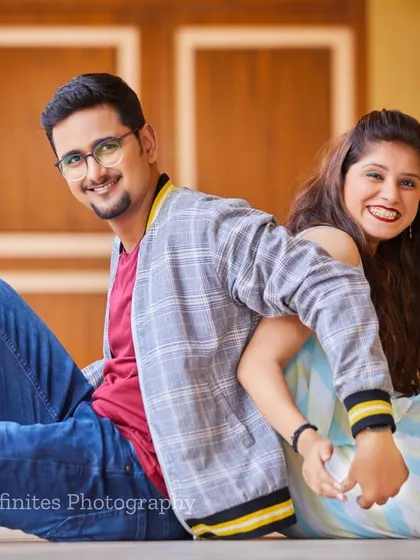 A simple, happy, and connected back-to-back pose that beautifully captures the joy and friendship in your relationship.