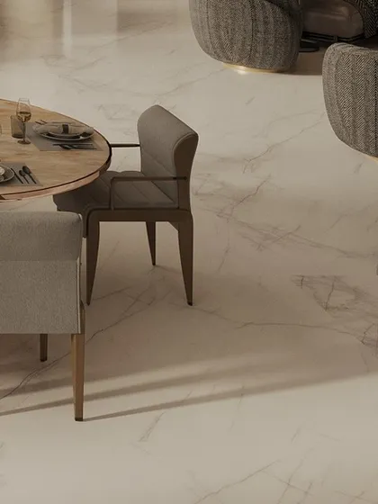 A detail shot of a dining and seating area in a Mumbai penthouse, showcasing the clean lines of the marble flooring and the sophisticated, neutral-toned furniture we selected.
