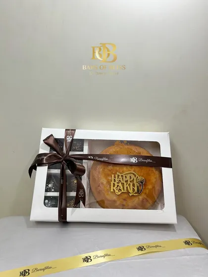 A still image of the elegant cake and cake pops hamper, a popular choice for Raksha Bandhan gifting.