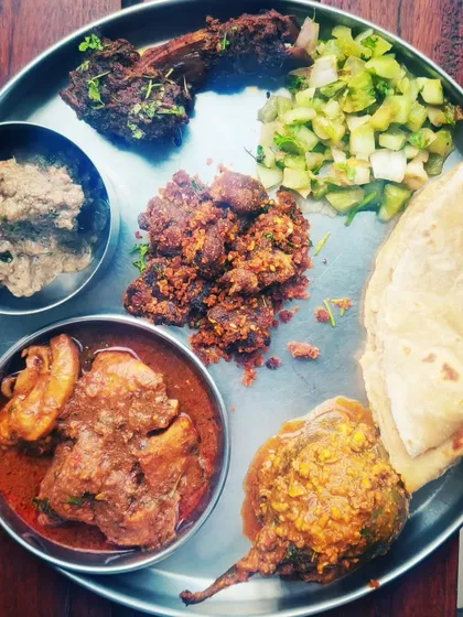My version of the Kolhapuri thali, featuring Chicken Kale Sukkha, Mutton Chops, and Mutton Loncha. It's a feast that showcases the diverse and delicious dishes from my region.