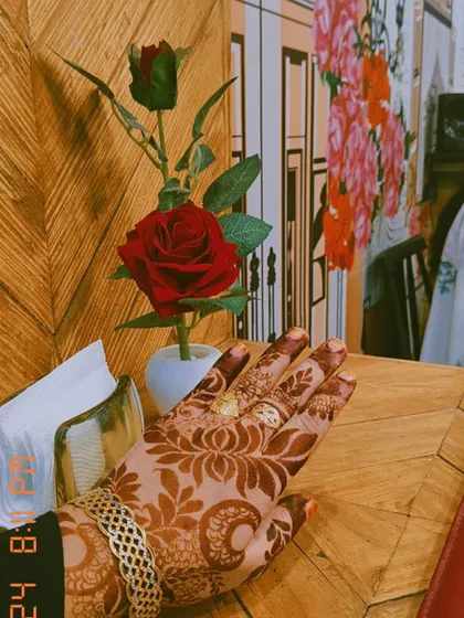 My henna-stained hand, ready for Eid. Bookings are open to get this beautiful, rich color for your special occasions. This is a classic floral design that never goes out of style.