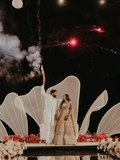 A grand reception entrance, complete with fireworks and a stunning stage setup. I capture both the epic scale and the personal joy of your biggest celebrations.