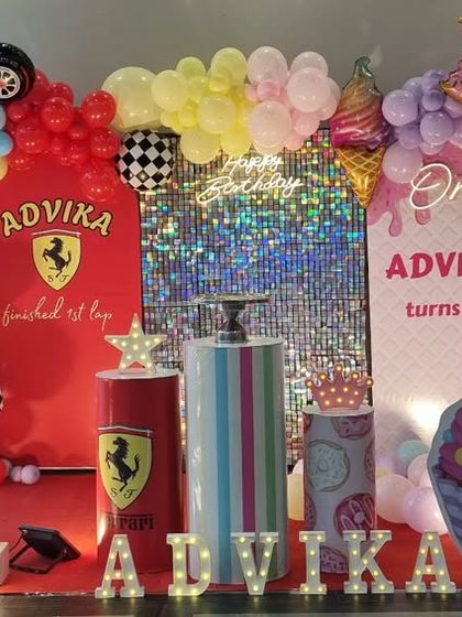 A creative split-theme birthday party combining a Ferrari car theme and a Candyland theme for a joint celebration.