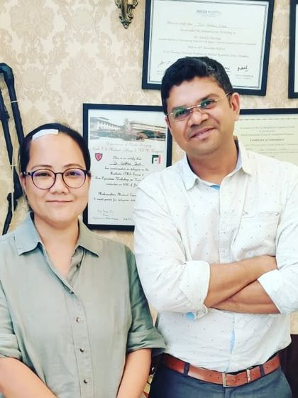 With Dr. Joken Bam, a respected colleague and scientist. It's an honor to collaborate with and treat professionals from around the world.