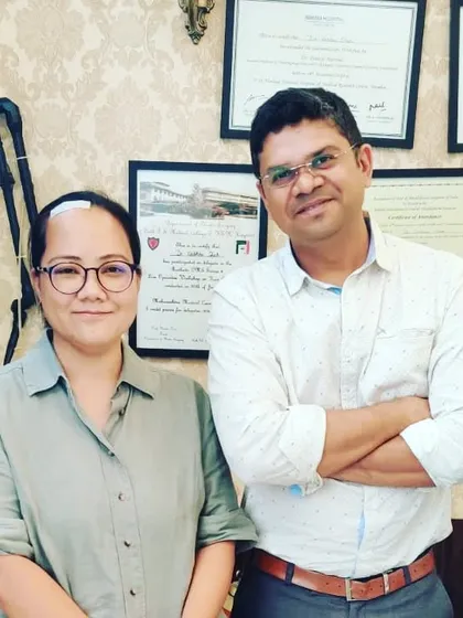 With Dr. Joken Bam, a respected colleague and scientist. It's an honor to collaborate with and treat professionals from around the world.
