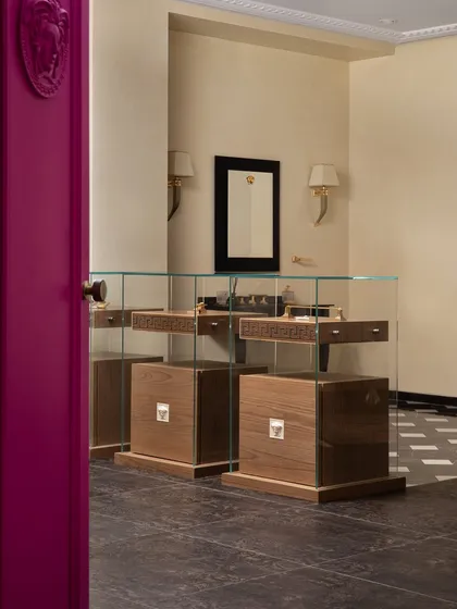 Behind these vibrant fuschia doors in a luxury tiles showroom lies a private viewing space for Versace’s exquisite tile collection. I designed this exclusive room to be a visual feast of opulence and elegance.