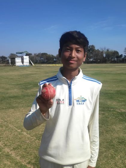 Omkar holding the match ball after his 5-wicket haul.