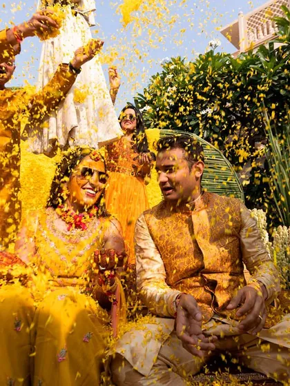 A Haldi ceremony is all about joy, and this moment captures it perfectly. I designed a vibrant, monochrome yellow setting, and seeing the couple showered in marigold petals is what makes my work so rewarding. It’s about creating the perfect backdrop for beautiful memories.