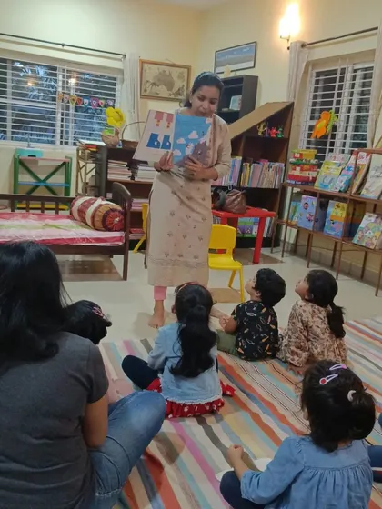 A close up of the storyteller showing a book about clouds and shapes. Our sessions encourage children to see the world around them in new and creative ways.