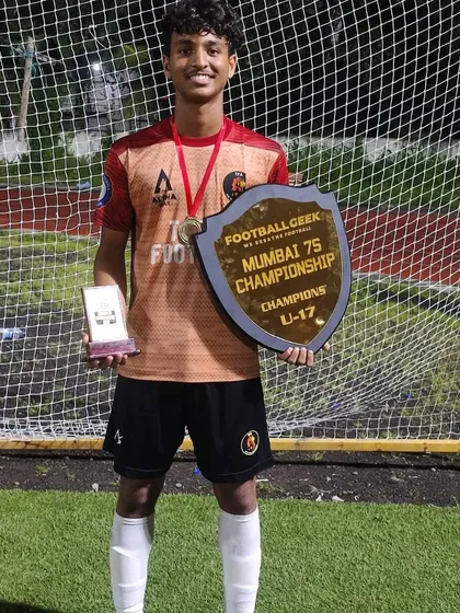 Our U17 player with his Best Player award and the championship shield.