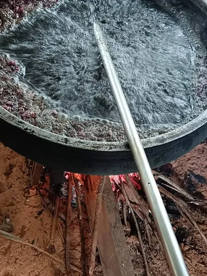 Here you can see our hair oil being prepared the traditional way, in a bronze uruli over a wood fire. This slow cooking process takes two days and helps infuse all the goodness of the herbs into the oil, which is what makes it so effective.