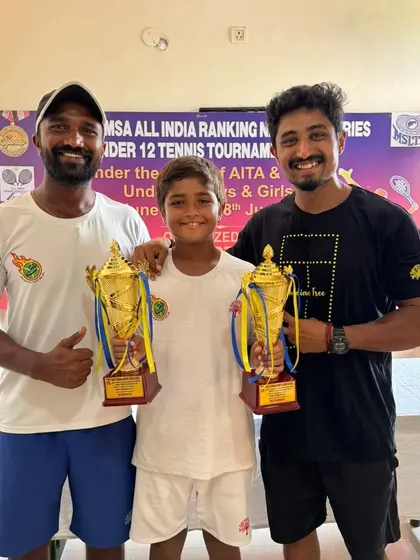 The coaching team with Aarav Chhallani and his two winner's trophies from the NMSA National Series.