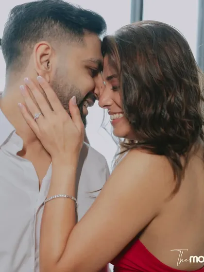 A portrait filled with laughter and affection. The couple's genuine smiles and close embrace create a heartwarming image that perfectly captures their chemistry.