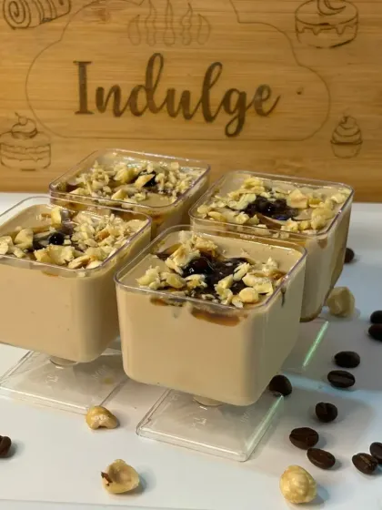 A modern twist on an Italian classic. This is my coffee panna cotta, made with hazelnut-flavoured coffee and topped with chewy coffee boba and crunchy hazelnuts.