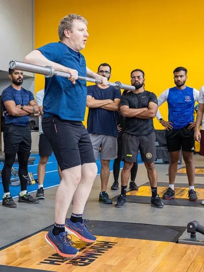 Assessment is a key part of our certification process. This moment captures a UKSCA trainer assessing a participant's weightlifting technique during the ASCC course, ensuring they meet the highest standards of coaching.