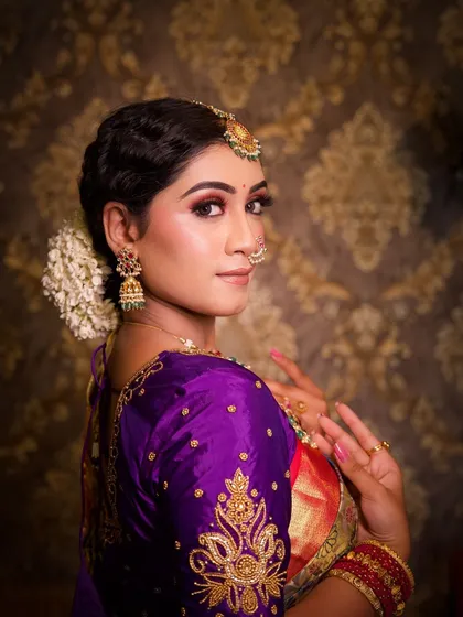 A beautiful portrait from the back, showing the details of the embroidered blouse and hairstyle.