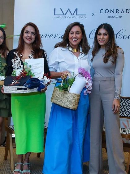 We provided the decor for this "Conversation over Cocktails" event. The large tropical plants and floral arrangements created a sophisticated and lush backdrop for the stage.