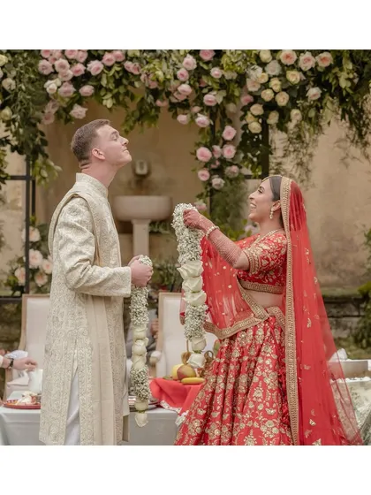 A playful moment during the varmala ceremony in Portugal, as Kingsley playfully dodges the garland from Sheline. It’s the spontaneous fun and laughter that make multicultural weddings so special to document.