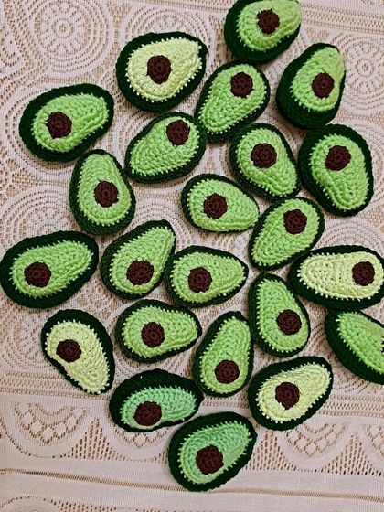A whole batch of healthy fats. These cute little avocado keychains are a fun and quirky accessory. Each one is crocheted in two shades of green with a little seed in the middle.