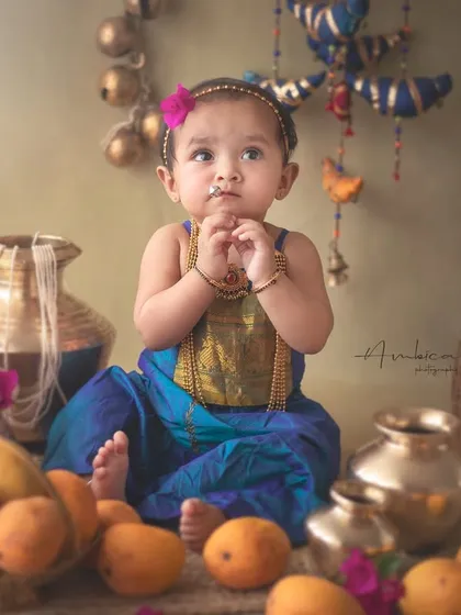 A thoughtful moment during our mango-themed shoot. The rich colors and traditional props create a vibrant scene that celebrates Indian culture and seasons.